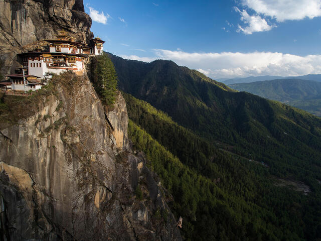 Epic view of Paro Taktsang Monastery nestled on the cliffside of the Paro valley in Bhutan. 