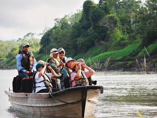 Tourists in boat on Amazon