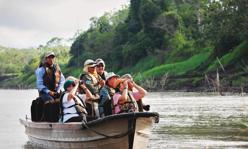 Tourists in boat on Amazon