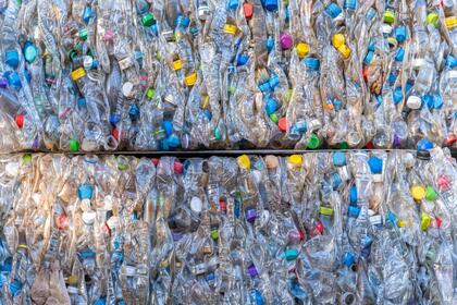Bales of compressed recyclable plastic materials stacked at waste sorting plant