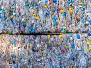 Bales of compressed recyclable plastic materials stacked at waste sorting plant