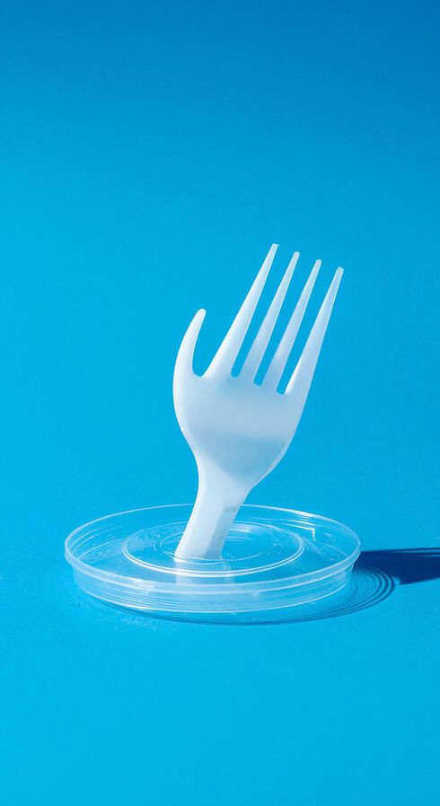 A plastic fork molded to look like a hand
