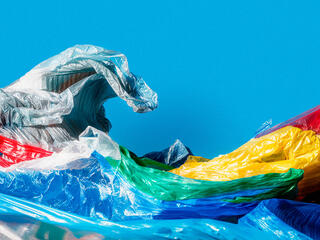 Colorful plastic bags molded into the shape of a wave