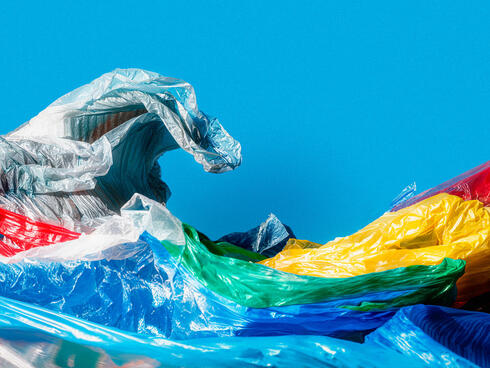 Colorful plastic bags molded into the shape of a wave