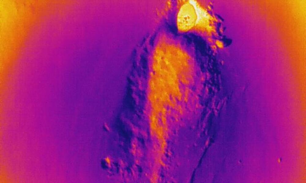 An empty polar bear den illuminated through thermal imagery on a remote-controlled flying drone.