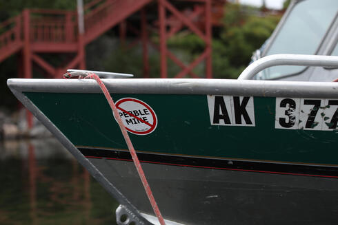 Prow of boat with sticker against Pebble Mine