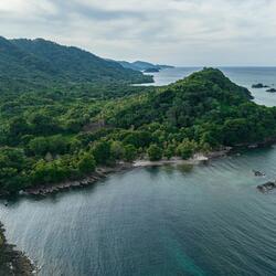 Aerial view of a mountainous coastal seascape of Sapzurro, Choco, Colombia