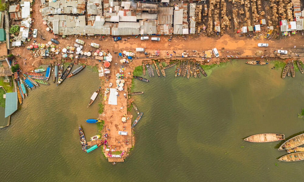 Aerial photo of a small port with ships and loading goods