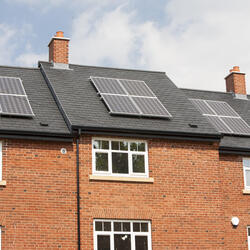 Solar panels on new build housing in Macclesfield, Cheshire, UK.