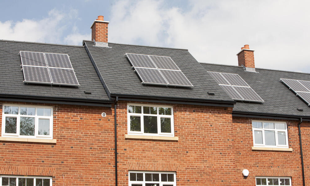 Solar panels on new build housing in Macclesfield, Cheshire, UK.
