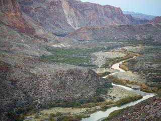 A river winds through a rocky canyon