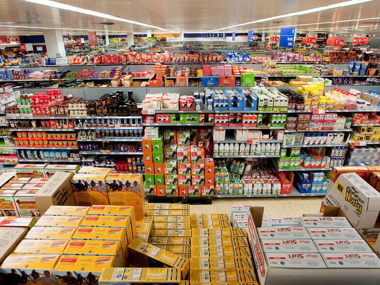 Aisles of fully-stocked shelves in a typical Western supermarket