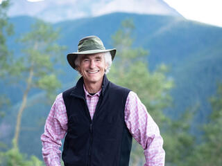 T.A. Barron in front of mountain