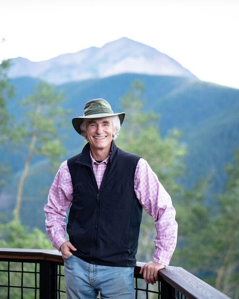 T.A. Barron in front of mountain