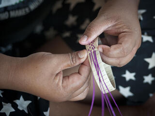 weaving a bracelet