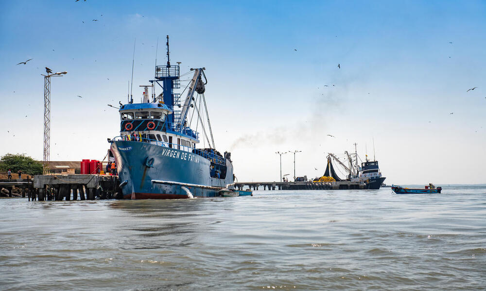 A tuna fishing boat docked in Ecuador on a sunny day