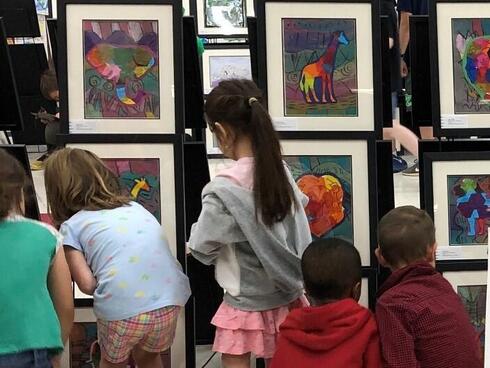 Students and artwork from an Earth Day art show