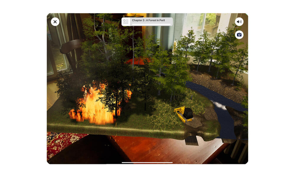Screenshot of room with AR forest fire and bulldozer