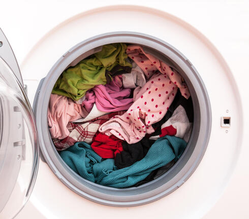 Washing machine full of clothes