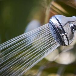 Water flowing from a shower head