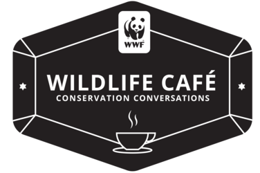 A dark gray diamond shape. Inside it the text reads 'Wildlife Cafe Conservation Conversations'. There is a icon of a steaming coffee cup. The WWF logo is at the top.