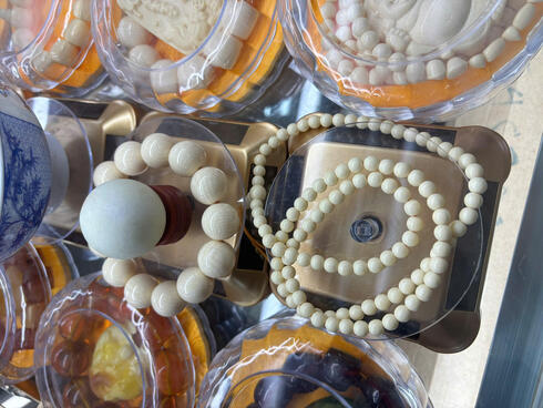 White beads and other items on table