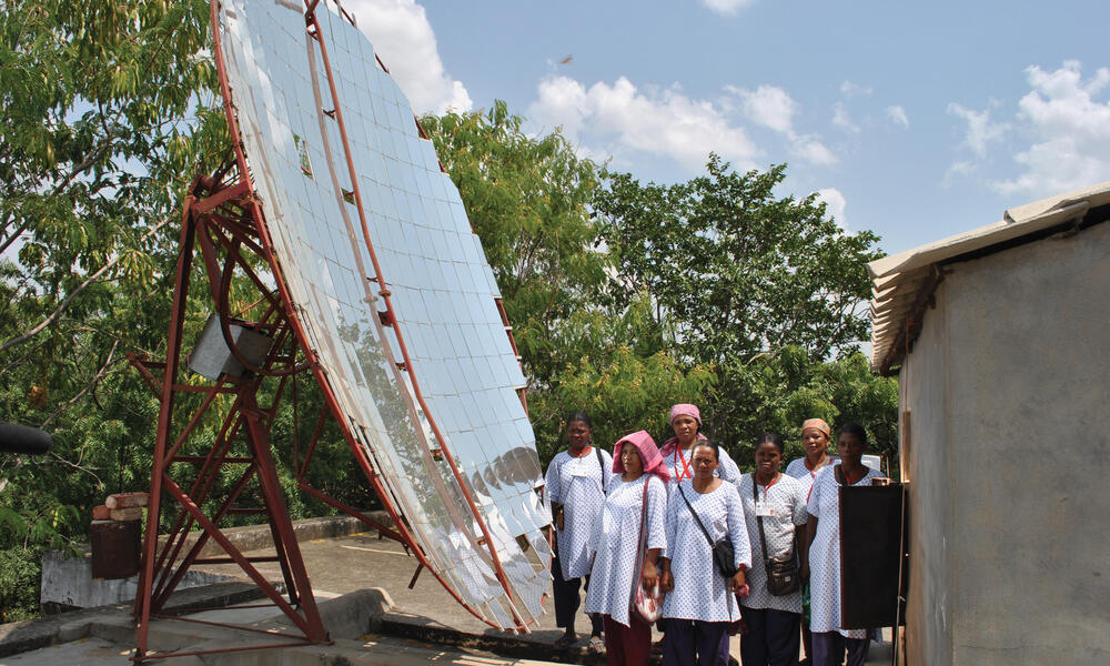 women by solar panel
