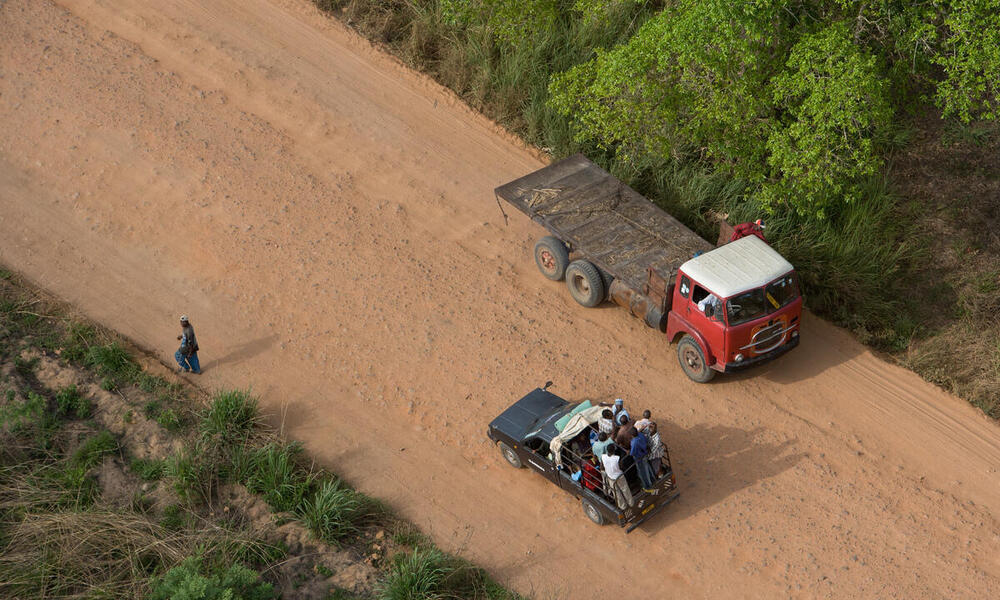 Arial view on farming truck on road (photographed from helicopter)