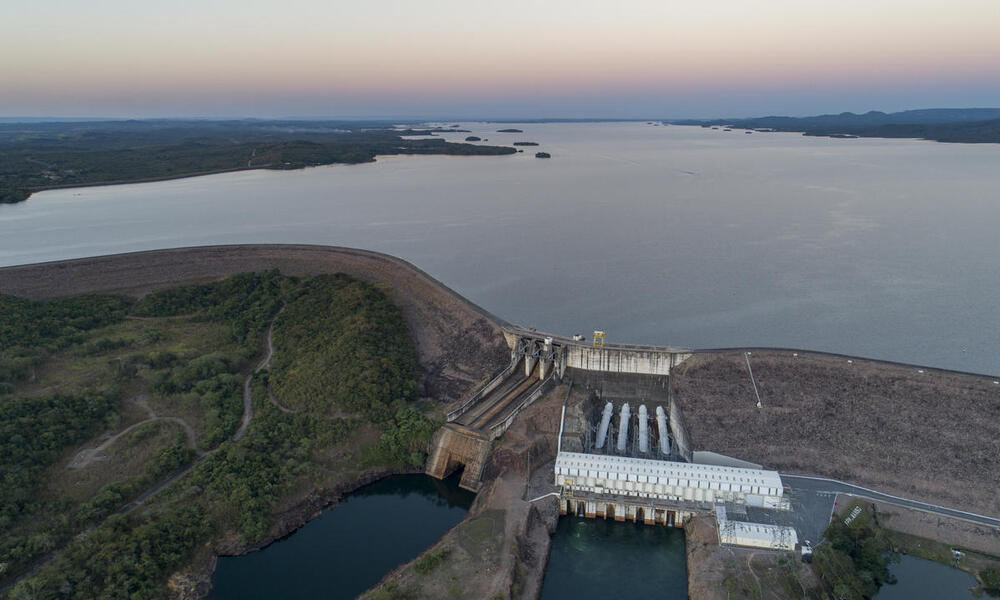 Aerial view of a dam holding back a large river in Brazil