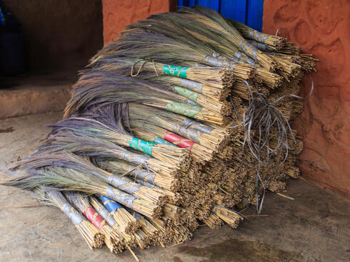 A pile of completed brooms