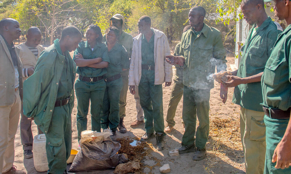 Stephan Mulanda shows a group of guards how to make chili bombs.
