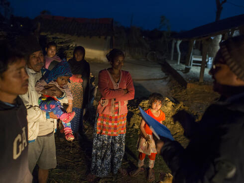 Rapid Response Team is arriving in a house to help villagers to deal with a wildlife conflict. Khata Corridor, Nepal.