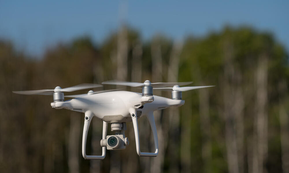 drone heads into forest