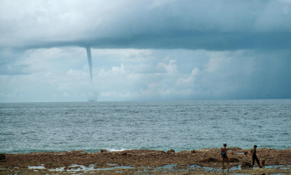 Tornado building from a cyclone over the sea. N.W. monsoon, Indonesia.