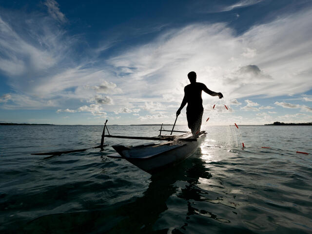 Gill net fisher on water