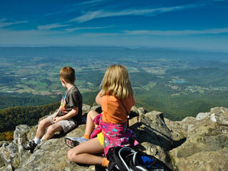 Owen and Audrey look west from a ridge