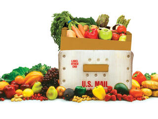Vegetables overflowing a mail container
