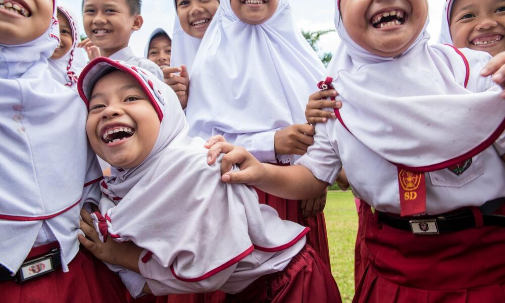 children gathered for mobile education unit in Sumatra
