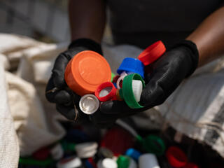 A handful of discarded plastic caps