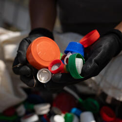 A handful of discarded plastic caps