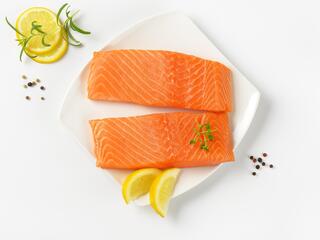 Two raw salmon fillets on a plate