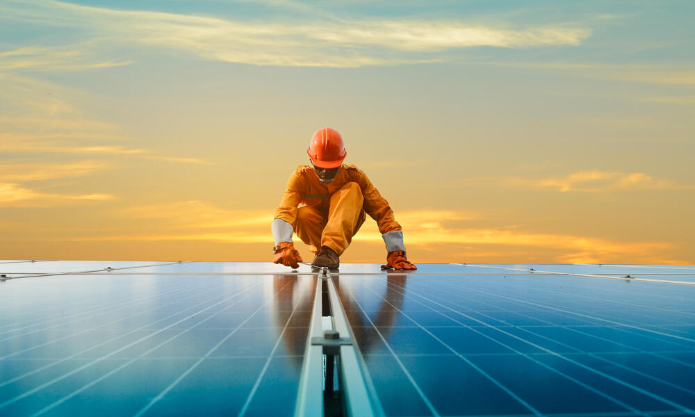 A man working at solar power station