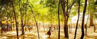 A group of children at play outside of Mwanguda primary school in Kenya