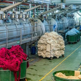 Vats of fabric dyeing in an industrial plant