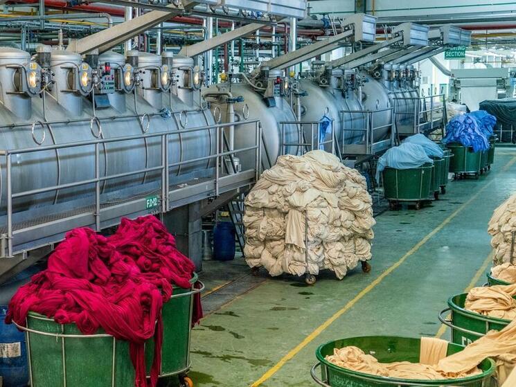 Vats of fabric dyeing in an industrial plant