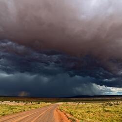 gatherine storm clouds over a field