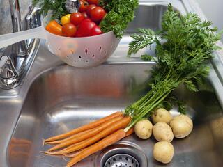 vegetables in a kitchen sink